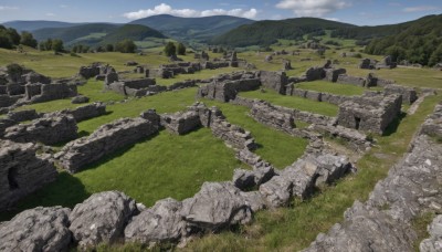 outdoors,sky,day,cloud,tree,blue sky,no humans,grass,nature,scenery,rock,mountain,road,field,landscape,mountainous horizon,hill,cliff,cloudy sky,forest,ruins,river,path,stone