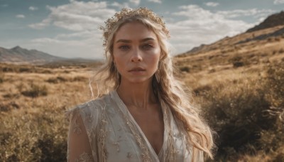 1girl,solo,long hair,looking at viewer,blue eyes,blonde hair,hair ornament,dress,upper body,flower,outdoors,parted lips,sky,day,cloud,white dress,blurry,blue sky,lips,depth of field,blurry background,wavy hair,cloudy sky,mountain,realistic,nose,head wreath,field,flower field,collarbone,sunlight