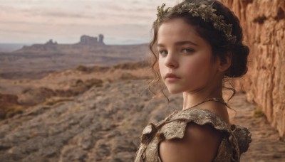 1girl,solo,looking at viewer,blue eyes,brown hair,black hair,dress,jewelry,closed mouth,upper body,outdoors,sky,cloud,dark skin,necklace,blurry,lips,blurry background,portrait,realistic,nose,bare shoulders,brown eyes,day,hair bun,black eyes,from side,tiara,sand,desert