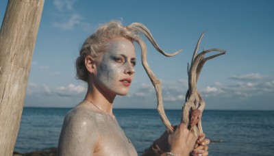 1girl,solo,looking at viewer,short hair,holding,jewelry,upper body,grey hair,nude,earrings,outdoors,parted lips,sky,teeth,day,cloud,water,necklace,bracelet,from side,blue sky,lips,fingernails,wet,ocean,watermark,beach,monster girl,genderswap,realistic,blonde hair,hair bun,single hair bun,horizon,shell