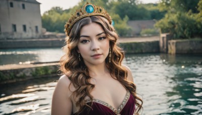 1girl,solo,long hair,breasts,looking at viewer,smile,brown hair,dress,cleavage,bare shoulders,brown eyes,jewelry,medium breasts,closed mouth,upper body,earrings,outdoors,day,water,blurry,black eyes,tree,lips,depth of field,blurry background,wavy hair,tiara,crown,purple dress,curly hair,realistic,river,princess,sunlight,gem