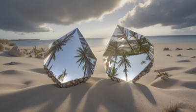 outdoors,sky,day,cloud,tree,blue sky,no humans,shadow,ocean,beach,sunlight,cloudy sky,scenery,rock,sand,palm tree,horizon,shade,shore,desert,footprints,water