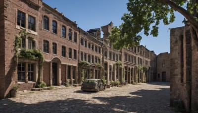 outdoors,sky,day,tree,blue sky,no humans,window,shadow,sunlight,plant,ground vehicle,building,scenery,motor vehicle,door,car,road,ruins,house,street,overgrown,shade,arch,real world location