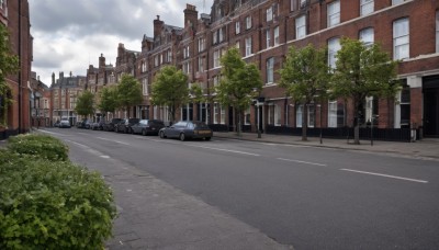 outdoors,sky,day,cloud,tree,blue sky,no humans,window,cloudy sky,ground vehicle,building,scenery,motor vehicle,city,car,road,bush,cityscape,house,lamppost,street,crosswalk,watermark