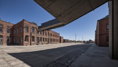 outdoors,sky,day,blue sky,no humans,window,shadow,building,scenery,city,door,road,cityscape,house,lamppost,street,cloud,tree,ground vehicle,motor vehicle,church,pavement,real world location