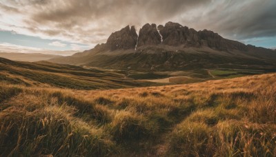 outdoors,sky,day,cloud,blue sky,no humans,cloudy sky,grass,nature,scenery,mountain,field,landscape,mountainous horizon,hill,rock