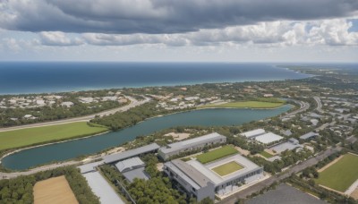 outdoors,sky,day,cloud,water,tree,blue sky,no humans,ocean,beach,cloudy sky,building,nature,scenery,mountain,city,horizon,road,cityscape,house,river,landscape,shore,bird,from above,ground vehicle,forest,bush