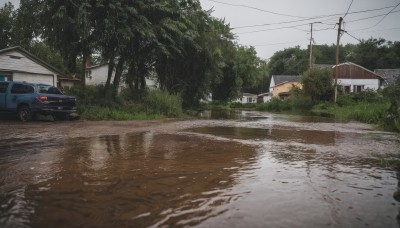 outdoors,sky,day,cloud,water,tree,no humans,window,grass,ground vehicle,building,nature,scenery,motor vehicle,forest,reflection,rain,car,road,bush,house,vehicle focus,power lines,street,utility pole,puddle,realistic,fence,truck