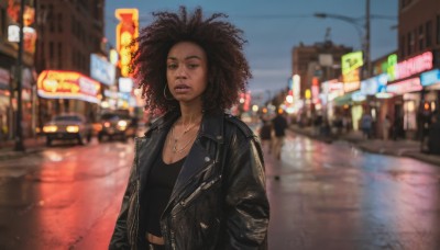 1girl,solo,long hair,breasts,brown hair,black hair,cleavage,brown eyes,jewelry,medium breasts,jacket,upper body,earrings,outdoors,parted lips,open clothes,midriff,dark skin,necklace,blurry,open jacket,dark-skinned female,lips,black jacket,black shirt,dutch angle,blurry background,ground vehicle,building,motor vehicle,curly hair,hoop earrings,city,realistic,nose,road,leather,big hair,street,very dark skin,leather jacket,afro,looking at viewer,shirt,pants,medium hair,night,depth of field,cross,denim,forehead,jeans,neon lights