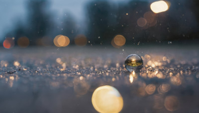 sky, blurry, no humans, night, depth of field, blurry background, star (sky), scenery, light particles, bokeh, city lights