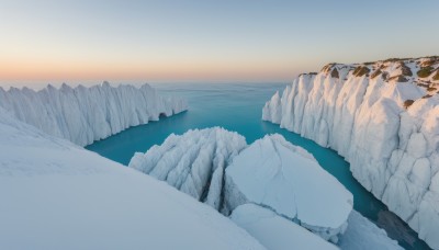 outdoors,sky,day,water,blue sky,no humans,ocean,scenery,snow,ice,rock,mountain,horizon,winter,river,landscape,mountainous horizon,lake,gradient sky,shore,cloud,tree,sunset