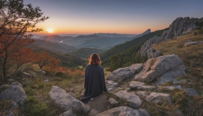 1girl,solo,long hair,brown hair,sitting,outdoors,sky,cloud,medium hair,from behind,cape,tree,bird,grass,nature,scenery,sunset,rock,mountain,sun,facing away,wide shot,evening,mountainous horizon,orange sky,short hair,signature,water,horizon,river,landscape,sunrise