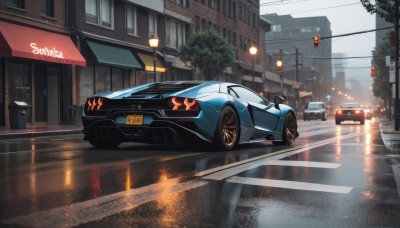 outdoors,sky,tree,no humans,window,night,ground vehicle,building,scenery,motor vehicle,reflection,rain,city,sign,car,road,vehicle focus,power lines,lamppost,street,utility pole,road sign,puddle,traffic light,sports car,crosswalk,sidewalk