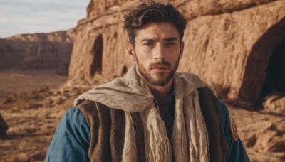 solo,looking at viewer,short hair,brown hair,black hair,1boy,brown eyes,closed mouth,upper body,male focus,outdoors,day,scarf,blurry,black eyes,blurry background,facial hair,beard,realistic,stubble,animification,photo background,desert,sky,sand