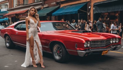 1girl,long hair,breasts,multiple girls,brown hair,dress,jewelry,standing,earrings,outdoors,multiple boys,shoes,solo focus,dark skin,white dress,high heels,bracelet,dark-skinned female,strapless,makeup,formal,sunglasses,suit,lipstick,ground vehicle,motor vehicle,6+boys,toenails,realistic,car,vehicle focus,toeless footwear,sports car,real world location,halterneck,lace,crowd