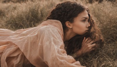 1girl,solo,long hair,brown hair,black hair,long sleeves,dress,jewelry,upper body,earrings,outdoors,lying,dark skin,from side,dark-skinned female,lips,profile,on side,grass,on stomach,freckles,curly hair,realistic,on ground,closed mouth,braid,white dress,looking away,looking afar