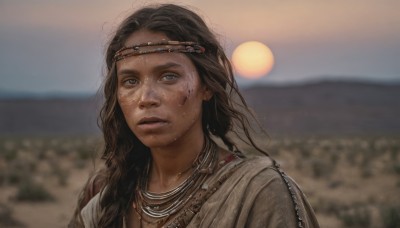 1girl,solo,long hair,looking at viewer,brown hair,black hair,brown eyes,jewelry,upper body,braid,sweat,outdoors,parted lips,sky,teeth,dark skin,necklace,blurry,dark-skinned female,lips,depth of field,blurry background,headband,portrait,freckles,circlet,realistic,dirty,desert,blue eyes,bag,backpack,messy hair,sun,facepaint,dirty face,tribal