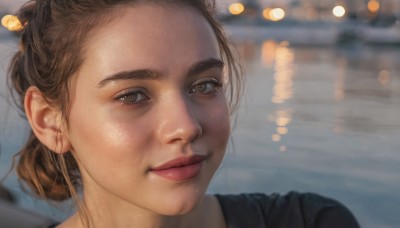 1girl,solo,looking at viewer,smile,brown hair,shirt,brown eyes,jewelry,closed mouth,earrings,outdoors,hair bun,blurry,lips,black shirt,depth of field,blurry background,single hair bun,portrait,realistic,nose,hair ornament,eyelashes,close-up,bokeh