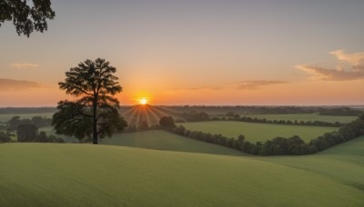 outdoors,sky,cloud,tree,no humans,ocean,sunlight,cloudy sky,grass,nature,scenery,forest,sunset,mountain,sun,horizon,landscape,mountainous horizon,orange sky,hill,gradient sky,yellow sky