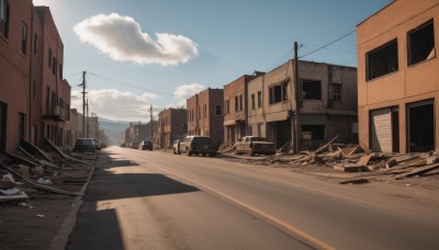 outdoors,sky,day,cloud,blue sky,no humans,window,cloudy sky,ground vehicle,building,scenery,motor vehicle,city,car,road,house,power lines,street,utility pole,truck,shadow