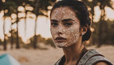 1girl,solo,looking at viewer,short hair,black hair,brown eyes,jewelry,closed mouth,upper body,earrings,outdoors,dark skin,hair bun,blurry,black eyes,dark-skinned female,lips,depth of field,blurry background,facial mark,single hair bun,portrait,realistic,nose,dress