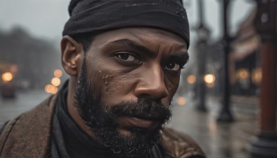 solo,looking at viewer,short hair,black hair,1boy,jacket,upper body,male focus,outdoors,dark skin,blurry,black eyes,depth of field,blurry background,facial hair,dark-skinned male,thick eyebrows,portrait,beard,mature male,realistic,bandana,mustache,beanie,closed mouth,black headwear,headband,scar,close-up