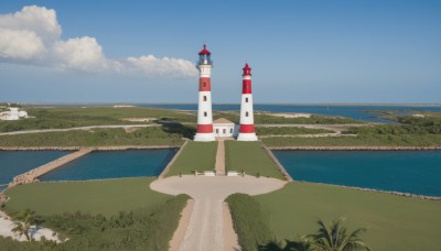 outdoors,sky,day,cloud,water,tree,blue sky,no humans,ocean,cloudy sky,grass,building,scenery,horizon,road,river,castle,tower,landscape,path,hill,beach,nature,sand,bush,bridge,shore,lighthouse