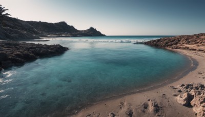 outdoors,sky,day,water,tree,blue sky,no humans,ocean,beach,scenery,rock,sand,horizon,waves,shore,footprints,cloud,nature,mountain,palm tree,landscape