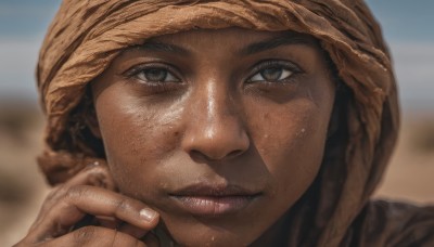 1girl,solo,looking at viewer,brown hair,1boy,brown eyes,male focus,outdoors,parted lips,day,hand up,dark skin,blurry,lips,fingernails,depth of field,blurry background,portrait,close-up,freckles,realistic,nose,dirty,hat,jewelry,closed mouth,earrings,grey eyes,eyelashes,desert