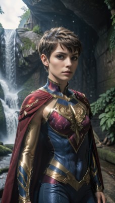 1girl,solo,breasts,looking at viewer,short hair,brown hair,black hair,brown eyes,standing,cowboy shot,outdoors,parted lips,detached sleeves,water,cape,armor,blurry,lips,bodysuit,covered navel,skin tight,breastplate,realistic,nose,arms at sides,red cape,very short hair,superhero,waterfall,closed mouth,day,blue bodysuit