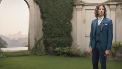 1girl,solo,looking at viewer,short hair,brown hair,shirt,long sleeves,brown eyes,closed mouth,standing,jacket,white shirt,outdoors,collared shirt,pants,medium hair,vest,tree,lips,buttons,black pants,formal,suit,grass,plant,blue jacket,curly hair,realistic,arms at sides,blue pants,bush,blue vest,pillar,1boy,male focus,open clothes,sky,day,wavy hair,expressionless,scenery,ruins,arch,moss