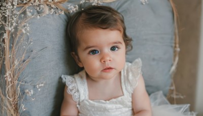 1girl,solo,looking at viewer,short hair,blue eyes,brown hair,dress,closed mouth,upper body,frills,sleeveless,white dress,lips,pillow,sleeveless dress,child,realistic,branch,female child,blurry,tree,expressionless,looking up,bare tree