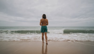 1girl,solo,black hair,1boy,standing,male focus,outdoors,sky,shorts,barefoot,day,cloud,dark skin,water,hair bun,from behind,ocean,back,beach,single hair bun,dark-skinned male,cloudy sky,scenery,walking,topless male,sand,facing away,male swimwear,waves,swim trunks,medium hair,shadow,reflection,horizon,wide shot,footprints