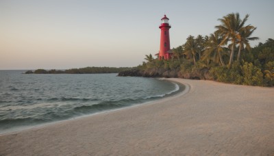 outdoors,sky,day,water,tree,no humans,ocean,beach,plant,building,scenery,sand,palm tree,horizon,road,bush,tower,shore,lighthouse,cloud,traditional media,nature,sunset