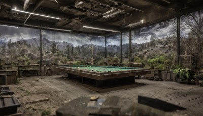 outdoors,sky,day,cloud,indoors,water,blurry,tree,no humans,window,depth of field,table,sunlight,cloudy sky,plant,building,nature,scenery,forest,wooden floor,mountain,architecture,ruins,landscape,watercraft,railroad tracks