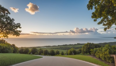 outdoors,sky,day,cloud,water,tree,blue sky,no humans,ocean,cloudy sky,grass,nature,scenery,forest,sunset,mountain,horizon,road,bush,landscape,mountainous horizon,path,hill,sunlight