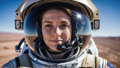 1girl,solo,looking at viewer,smile,brown hair,1boy,brown eyes,closed mouth,upper body,male focus,outdoors,sky,day,blurry,blue sky,lips,blurry background,helmet,portrait,lens flare,freckles,science fiction,glint,realistic,dirty,american flag,spacesuit,desert,space helmet,united states,astronaut,reflection,camera,planet