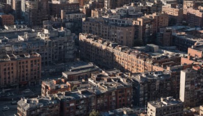 outdoors,tree,no humans,window,from above,ground vehicle,building,scenery,stairs,city,sign,road,cityscape,skyscraper,motor vehicle,car,real world location