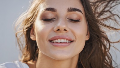 1girl,solo,long hair,smile,open mouth,simple background,brown hair,shirt,closed eyes,white shirt,lying,parted lips,teeth,on back,grey background,grin,blurry,lips,thick eyebrows,portrait,facing viewer,close-up,realistic,nose,blonde hair,tree,eyelashes,clenched teeth,bare tree