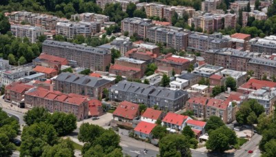 outdoors,day,tree,no humans,from above,building,scenery,city,road,cityscape,ground vehicle,nature,motor vehicle,forest,car,bridge,river,real world location