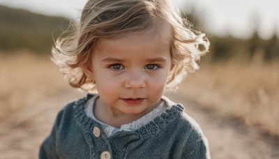 1girl,solo,looking at viewer,short hair,blonde hair,brown hair,shirt,dress,brown eyes,closed mouth,upper body,outdoors,tongue,tongue out,blurry,lips,buttons,depth of field,blurry background,wind,child,portrait,curly hair,realistic,female child,day,eyelashes