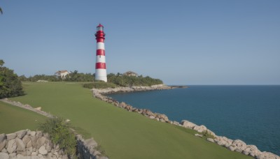 outdoors,sky,day,water,tree,blue sky,no humans,ocean,grass,building,nature,scenery,rock,horizon,bush,river,landscape,cliff,lighthouse,road,shore,traffic cone