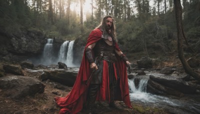 solo,long hair,looking at viewer,brown hair,1boy,holding,standing,full body,weapon,male focus,boots,outdoors,belt,sword,water,cape,holding weapon,armor,tree,facial hair,sheath,nature,scenery,beard,forest,sheathed,rock,realistic,red cape,bracer,river,waterfall,jewelry,knife,fantasy,dagger