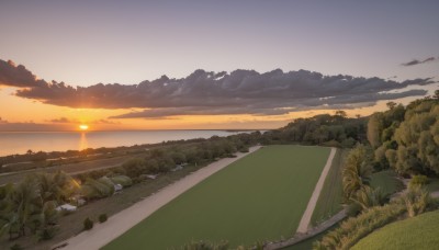 outdoors,sky,cloud,water,tree,no humans,ocean,sunlight,cloudy sky,grass,plant,nature,scenery,sunset,mountain,sun,horizon,road,field,river,landscape,orange sky,hill,rock,bush,mountainous horizon,path