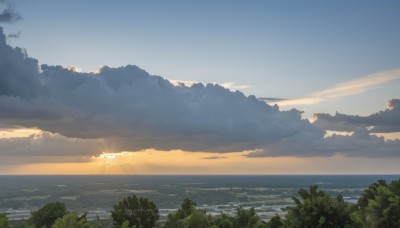 outdoors,sky,day,cloud,water,tree,blue sky,no humans,ocean,sunlight,cloudy sky,nature,scenery,forest,sunset,sun,horizon,landscape,sunrise,beach