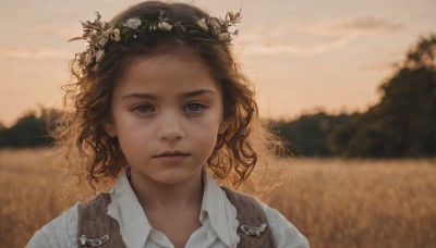 1girl,solo,looking at viewer,short hair,brown hair,shirt,hair ornament,closed mouth,white shirt,upper body,flower,outdoors,sky,collared shirt,blurry,vest,lips,depth of field,blurry background,wavy hair,expressionless,portrait,freckles,curly hair,realistic,head wreath,field,blue eyes,cloud,wind,messy hair,sunset