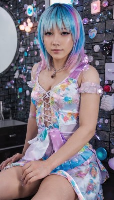 1girl,solo,breasts,looking at viewer,short hair,bangs,blue eyes,dress,cleavage,bare shoulders,jewelry,medium breasts,sitting,blue hair,pink hair,multicolored hair,small breasts,parted lips,sleeveless,necklace,nail polish,black eyes,two-tone hair,lips,fingernails,gradient hair,sleeveless dress,realistic,nose,brick wall,arm garter,skirt,wings