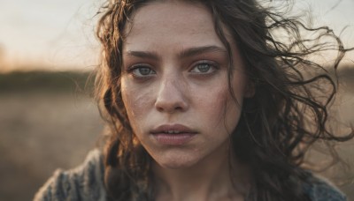 1girl,solo,long hair,looking at viewer,brown hair,black hair,brown eyes,outdoors,parted lips,teeth,blurry,lips,depth of field,blurry background,wavy hair,messy hair,portrait,freckles,curly hair,realistic,nose,floating hair,scar,wind,close-up,dirty