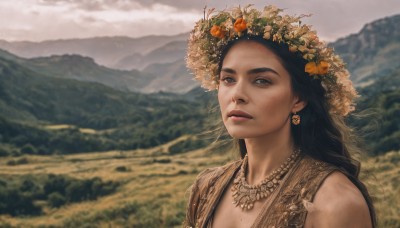 1girl,solo,long hair,looking at viewer,blue eyes,black hair,hair ornament,jewelry,upper body,flower,earrings,outdoors,parted lips,sky,sleeveless,day,cloud,hair flower,necklace,mole,blurry,lips,depth of field,blurry background,cloudy sky,portrait,nature,scenery,freckles,mountain,realistic,nose,head wreath,field,mountainous horizon,breasts,dress,cleavage,wind,mole on breast,orange flower,mole on cheek