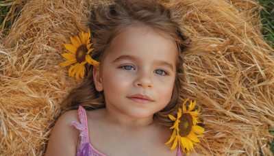 1girl,solo,long hair,looking at viewer,blue eyes,brown hair,hair ornament,closed mouth,upper body,flower,outdoors,lying,sleeveless,hair flower,on back,lips,child,portrait,forehead,realistic,sunflower,female child,field,bare shoulders,grass